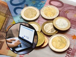 sfondo banconote e monete euro e tondo con persona al pc