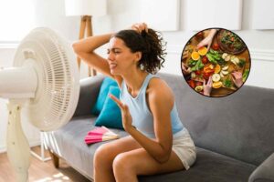 Donna di fronte al ventilatore e verdure
